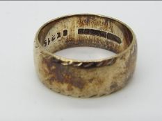A hallmarked 9ct gold wedding band, size M+½, approximately 5.9 grams all in.