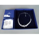 Swarovski - A boxed Swarovski 'Mineral Collar' necklace and a boxed pair of Swarovski crystal