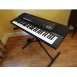 A Casio Tonebank CT-670 electronic keyboard with adjustable stand