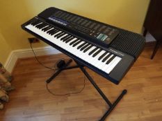 A Casio Tonebank CT-670 electronic keyboard with adjustable stand