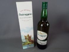 A bottle of Finlaggan Islay Single Malt 70 cl 40% ABV