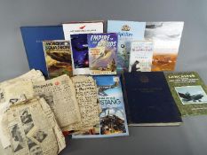 A quantity of military related books, predominantly aviation,