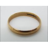 A 9ct gold hallmarked wedding band, size R, approximately 1.55 grams all in.