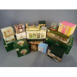 A collection of Lilliput Lane and similar models, predominantly boxed,