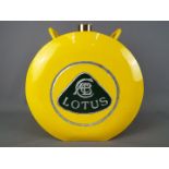 A yellow Lotus petrol can,