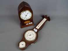 A modern Knight & Gibbins lancet top mantel clock and a wall barometer.
