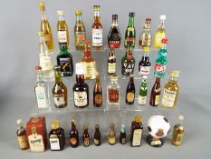 30 miniature bottles of whisky, gin,