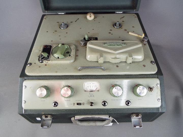 A Ferrograph Series 6, mono, half track, two head, reel to reel recorder in carry case.