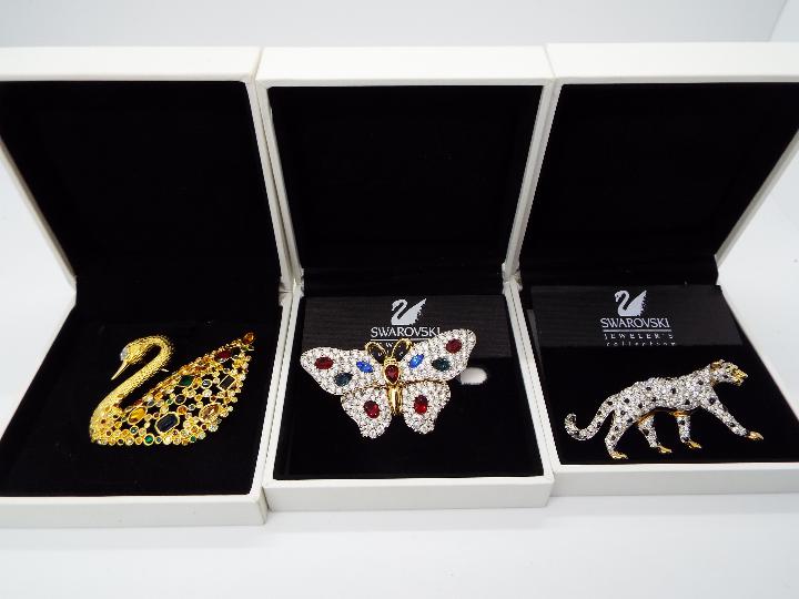 Swarovski - Three boxed Swarovski crystal encrusted brooches, two from the Jewelers Collection,