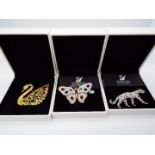 Swarovski - Three boxed Swarovski crystal encrusted brooches, two from the Jewelers Collection,