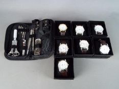 A collection of 7 unused modern quartz wristwatches on leather bands in presentation boxes,
