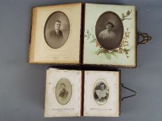 Two Victorian leather bound photograph albums,