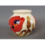 A Moorcroft vase in the Harvest Poppy design, approx height 7.
