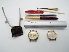 A small mixed lot of collectables to include pens, Victorinox knife,