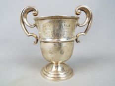 A George V twin handled, hallmarked silver trophy,