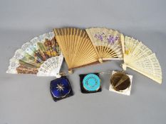 Three vintage powder compacts, two Stratton examples and a Melissa and four folding fans.