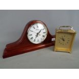 A Napoleon's hat style Windsor mantel clock and an Acctim carriage clock.