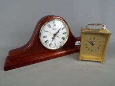 A Napoleon's hat style Windsor mantel clock and an Acctim carriage clock.
