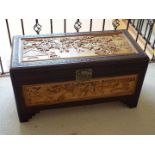 A linen chest with Oriental carved decoration,