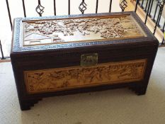 A linen chest with Oriental carved decoration,