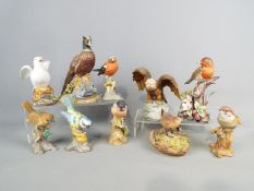 Ten bird figurines of varying size to include Kowa Porcelain and others, comprising Tree Sparrow,