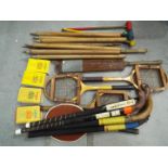 A collection of vintage sporting equipment to include tennis rackets,