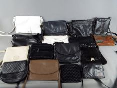 A collection of lady's handbags and similar.