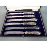 A cased set of George V silver handled butter knives, Sheffield assay 1910,