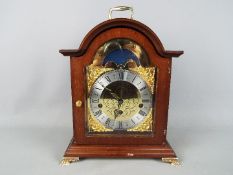 A Franz Hermle moon phase mantel clock.