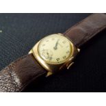 A 9ct gold cased Bernex 15 jewel wristwatch on brown leather strap.