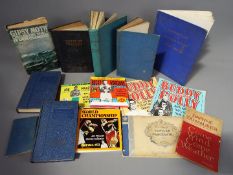 A collection of vintage books including Coast of Tragedy,