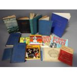 A collection of vintage books including Coast of Tragedy,
