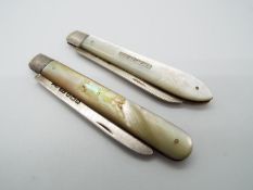 Two Edward VII silver and mother of pearl folding fruit knives,