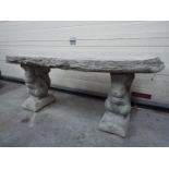 Garden Stoneware - A reconstituted stone garden bench with a timber effect seat and plinths in the