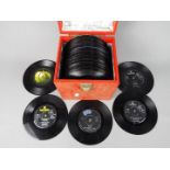 A collection of 7" vinyl records to include The Beatles, Paul McCartney & Wings and other.