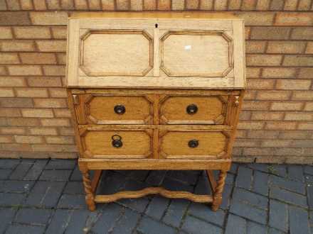 A bureau with fall flap front and two dr