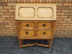 A bureau with fall flap front and two dr