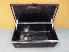 A large, vintage, metal chest measuring