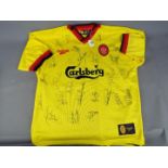 A Liverpool Football Club signed replica shirt from the 1997 - 1998 season bearing 24 signatures