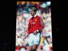 David Beckham - a glossy colour photograph of David Beckham bearing original signature,