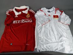 Two replica Football shirts comprising Wisla Krakow (home shirt) and Vietnam (away shirt).