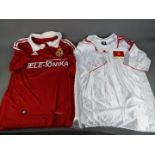 Two replica Football shirts comprising Wisla Krakow (home shirt) and Vietnam (away shirt).