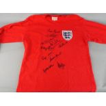 England World Cup Winners - A multi signed long sleeve, replica shirt signed by Nobby Stiles,