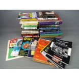 A collection of sporting interest books and magazines covering cricket, Olympics,