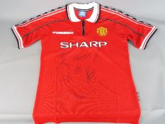 Manchester United - A reproduction 'Treble' shirt with multiple signatures including Teddy