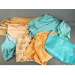 Saree / Sari - A three piece sari set in turquoise and a four piece set in peach tone.
