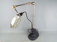 A retro angle poise desk lamp