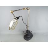 A retro angle poise desk lamp