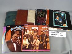 A large quantity of 12" vinyl records, jazz, swing and other, two boxes.