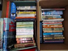 Two boxes containing a quantity of books and videos relating to trains and railways.